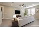 Comfortable living room with neutral walls, a large screen TV, and natural light, perfect for relaxing and entertaining at 11236 Rainbow Peak Ave # 210, Las Vegas, NV 89135