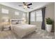 Serene main bedroom with soft lighting, neutral decor, and ample natural light from multiple windows at 11236 Rainbow Peak Ave # 210, Las Vegas, NV 89135