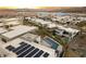 Exclusive community featuring modern homes, pools, and lake views at sunset at 12 Falling Canyon Ct, Henderson, NV 89011