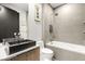 Modern bathroom features a sleek vessel sink and a luxurious bathtub with a rainfall shower head at 12 Falling Canyon Ct, Henderson, NV 89011