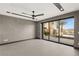 Bedroom with views of pool area and mountains, featuring large sliding glass doors for natural light at 12 Falling Canyon Ct, Henderson, NV 89011