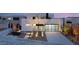 Modern home with a sleek garage door and illuminated landscaping at 12 Falling Canyon Ct, Henderson, NV 89011