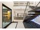 Grand foyer with open staircase, modern design, and bright natural light, flowing into the living space at 12 Falling Canyon Ct, Henderson, NV 89011