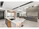 Spacious kitchen with a marble island, and stainless steel appliances, seamlessly connecting to the living area at 12 Falling Canyon Ct, Henderson, NV 89011