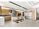 Open-concept kitchen with custom cabinetry, island with seating, stainless steel refrigerator, and modern finishes at 12 Falling Canyon Ct, Henderson, NV 89011
