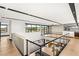 Open landing area with hardwood floors, stainless steel railings, and lots of natural light at 12 Falling Canyon Ct, Henderson, NV 89011