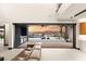 Indoor-outdoor living concept featuring an outdoor kitchen and stunning view at 12 Falling Canyon Ct, Henderson, NV 89011