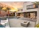 Upscale home with a sleek pool, fire pit, and modern design, ideal for elegant outdoor living and entertaining at 12 Falling Canyon Ct, Henderson, NV 89011
