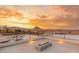 Expansive rooftop terrace featuring a linear fire pit, providing stunning panoramic views of the city and mountain range at 12 Falling Canyon Ct, Henderson, NV 89011