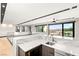 This wet bar features marble countertops, a sink, wine storage, and a scenic view at 12 Falling Canyon Ct, Henderson, NV 89011