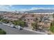 Picturesque aerial shot of a residential area featuring lovely homes, lush greenery, and mountain views at 1212 Equator Ave, North Las Vegas, NV 89032