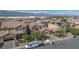 Expansive aerial view showcasing a residential neighborhood, with well-maintained homes and scenic mountain backdrop at 1212 Equator Ave, North Las Vegas, NV 89032