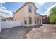 The backyard has a gravel groundcover and white fencing at 1212 Equator Ave, North Las Vegas, NV 89032