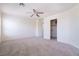 Spacious carpeted bedroom with a ceiling fan, and walk-in closet at 1212 Equator Ave, North Las Vegas, NV 89032