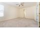 Bedroom featuring plush carpeting, a ceiling fan, and natural light at 1212 Equator Ave, North Las Vegas, NV 89032