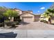 Inviting two-story home features a paved driveway, mature landscaping, and a spacious three-car garage at 1212 Equator Ave, North Las Vegas, NV 89032