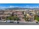 Beautiful two-story home featuring a lush lawn, mature trees, and a spacious three-car garage at 1212 Equator Ave, North Las Vegas, NV 89032