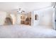 Bright open-concept living room features stairs, tile floors, and kitchen at 1212 Equator Ave, North Las Vegas, NV 89032