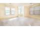 Large living room with neutral carpet, windows, and open space at 1212 Equator Ave, North Las Vegas, NV 89032