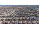 An expansive aerial view shows a densely populated residential community with many homes and streets at 1212 Equator Ave, North Las Vegas, NV 89032