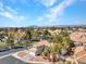 Scenic aerial view of a home nestled in a tranquil neighborhood, showcasing beautiful desert landscaping at 125 Firecreek Cir, Las Vegas, NV 89107