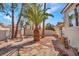 The backyard showcases mature landscaping, a patio area, and low-maintenance desert landscaping at 125 Firecreek Cir, Las Vegas, NV 89107