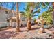The backyard features mature landscaping, a rock waterfall feature, and low-maintenance landscaping at 125 Firecreek Cir, Las Vegas, NV 89107