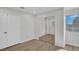 Bedroom showcasing mirrored closet doors, natural light, and wood-look flooring at 125 Firecreek Cir, Las Vegas, NV 89107