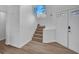 Welcoming entryway featuring wood-look floors and a staircase leading to the upper level of the home at 125 Firecreek Cir, Las Vegas, NV 89107