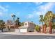 Beautiful two-story home featuring a tile roof, two-car garage, and meticulously kept front landscaping at 125 Firecreek Cir, Las Vegas, NV 89107