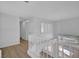 Second floor hallway showing chandelier over staircase and large window at 125 Firecreek Cir, Las Vegas, NV 89107