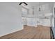 Bright and open living area featuring wood-look floors, high ceilings, and ample natural light throughout at 125 Firecreek Cir, Las Vegas, NV 89107