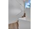 Bright staircase with white railing and wood stairs adjacent to a large bright window at 125 Firecreek Cir, Las Vegas, NV 89107
