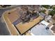 Aerial view of a single-story home featuring a large yard, mature trees, and a paved driveway in a residential neighborhood at 1400 Cottonwood Pl, Las Vegas, NV 89104