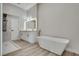 Modern bathroom featuring a soaking tub, double vanity, and a luxurious shower at 1400 Cottonwood Pl, Las Vegas, NV 89104