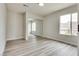 This bedroom features natural light from two windows and closet with sliding mirrored doors at 1400 Cottonwood Pl, Las Vegas, NV 89104