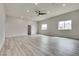 Spacious bedroom with natural light from two windows and a modern ceiling fan at 1400 Cottonwood Pl, Las Vegas, NV 89104