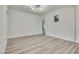 Empty bedroom with wood look floors, recessed lighting, and a neutral color palette at 1400 Cottonwood Pl, Las Vegas, NV 89104