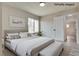 Virtually staged bedroom featuring a large window and neutral color scheme at 1400 Cottonwood Pl, Las Vegas, NV 89104