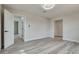 Spacious bedroom featuring light walls, light gray flooring, ceiling fan, and a closet at 1400 Cottonwood Pl, Las Vegas, NV 89104