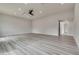 Spacious bedroom featuring neutral walls, light wood flooring, and modern ceiling fan at 1400 Cottonwood Pl, Las Vegas, NV 89104
