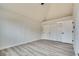 Bedroom features vaulted ceiling, light gray flooring, and closet with white sliding doors at 1400 Cottonwood Pl, Las Vegas, NV 89104