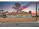 Charming single-story home with a well-maintained exterior, landscaped yard, and desert style landscape at 1400 Cottonwood Pl, Las Vegas, NV 89104