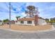 Charming single-story home with a well-maintained exterior, and desert style landscape at 1400 Cottonwood Pl, Las Vegas, NV 89104