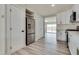 Modern kitchen with stainless steel appliances, white cabinets, and hardwood floors at 1400 Cottonwood Pl, Las Vegas, NV 89104