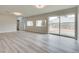 Expansive living room with hardwood floors and sliding glass doors to the backyard at 1400 Cottonwood Pl, Las Vegas, NV 89104