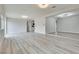 Open living room with hardwood floors and easy access to the kitchen and dining area at 1400 Cottonwood Pl, Las Vegas, NV 89104