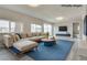 Spacious living room featuring hardwood floors, large windows, and ample seating at 1400 Cottonwood Pl, Las Vegas, NV 89104