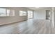 Bright, open living room with sleek floors, large windows, and ample space for entertaining at 1400 Cottonwood Pl, Las Vegas, NV 89104