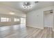 Open living room with hardwood floors, recessed lighting, and large windows at 1400 Cottonwood Pl, Las Vegas, NV 89104
